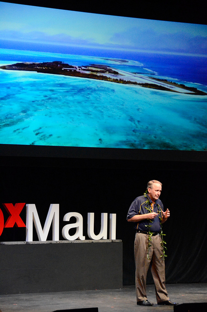 Byron Washom speaking on stage at TEDxMaui 2012